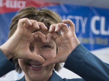 B.C. Liberal leader Christy Clark makes the heart symbol during a stop at her campaign headquarters in West Kelowna, B.C., Tuesday, May 9, 2017. The British Columbian's will go to the polls today.