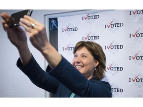 B.C. Liberal Leader Christy Clark takes a selfie at a poling station after casting her ballot in Vancouver on Tuesday.
