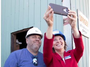 B.C. Liberal Leader Christy Clark takes a selfie with a mill worker as she tours NMV Lumber in Merritt on Tuesday, May 2, 2017.