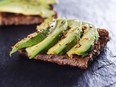 sliced avocado on toast bread with spices