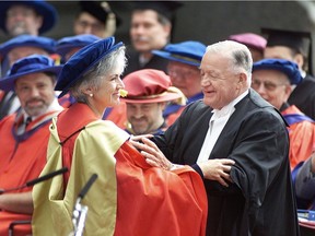 Former B.C. chief justice Allan McEachern (right) presents an honorary doctor of laws of degree in 2000 to current Supreme Court Chief Justice Beverley McLachlin at Simon Fraser University. McEachern died in 2008.
