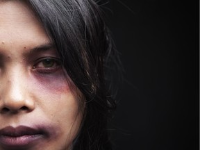 Domestic violence victim, a young Asian woman being hurt [PNG Merlin Archive]