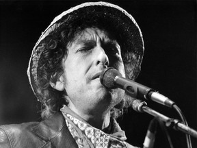 (FILES) This file photo taken on June 3, 1984 shows US singer Bob Dylan performing during a concert at the Olympic stadium in Munich, southern Germany. US songwriter Bob Dylan won the Nobel Literature Prize on October 13, 2016, the first songwriter to win the prestigious award and an announcement that surprised prize watchers. /