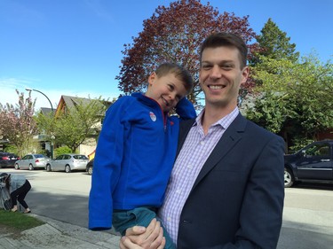Future voter Liam Cawsey, 4, with his dad Ryan Cawsey, outside Simon Fraser Elementary