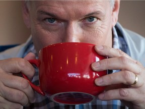 NDP Leader John Horgan drinks a cup of coffee during a campaign stop at a diner in Kamloops, B.C., on Tuesday May 2, 2017. A provincial election will be held on May 9.