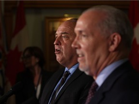 B.C. Green party leader Andrew Weaver speaks to media about working with B.C. NDP leader John Horgan after they signed an agreement on creating a stable minority government during a press conference in the Hall of Honour at Legislature in Victoria, B.C., on Tuesday, May 30, 2017.