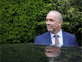 B.C. NDP leader John Horgan leaves from Government House after dropping of a signed document by 44 MLAs showing there is an agreement between the NDP and Greens, in Victoria, B.C., on Wednesday, May 31, 2017.
