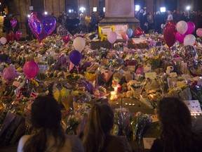 People of Manchester pay their respects at a vigil in St. Anne's Square.