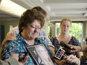 Markita Tracy holds photos of her daughter Kassandra Kaulius as she speaks to reporters outside provincial court in Surrey when Natasha Warren, the drunk driver who killed Kaulius, pleaded guilty to three charges: dangerous driving causing death, impaired driving causing death and failure to stop at an accident.