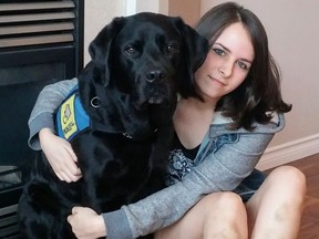 Asia Temlett, 25 and her dog Raven after being rescued from the icy waters of Gold Creek in Golden Ears Provincial Park last week. Both Temlett and Raven were caught in the glacial runoff waters and were rescued by passing hikers. Temlett has bruises on her legs from being bashed against the rocks.