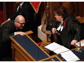 B.C. Finance Minister Michael de Jong and Speaker of the House Linda Reid speak before delivering a balanced budget in Victoria, B.C. on Tuesday, Feb. 21, 2017.