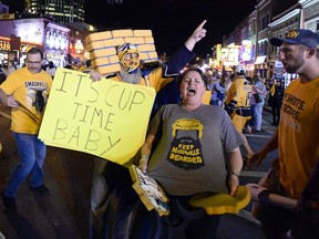 Nashville Predators fans celebrate after their team’s 6-3 win over the visiting Anaheim Duck Monday to take the Western Conference final in six games. With the victory, the Predators advanced to the franchise’s first ever Stanley Cup final.