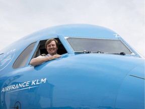 This handout photo taken on May 16, 2017 and provided by the KLM Royal Dutch Airlines on May 17, 2017 shows Dutch King Willem-Alexander looking out from the window of a KLM Cityhopper aircraft at Schiphol Airport, near Amsterdam.  Dutch King Willem-Alexander, who works part-time as a commercial pilot, is to start conversion training to fly Boeing 737 passenger jets, a Dutch newspaper reported on May 17. The conversion training will mean the royal can continue to fly twice a month for KLM as a co-pilot.