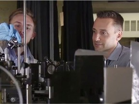 Jonathan F. Holzman (right), a UBC Okanagan engineer professor, is pictured in this handout photo working alongside a student in a lab.