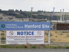 U.S. investigators have said that problems first identified six years ago at a Washington state plant where deadly nuclear waste would be treated continue to plague the multi-billion dollar facility. In this July 9, 2014 file photo, a sign informs visitors of prohibited items on the Hanford Nuclear Reservation near Richland, Wash.