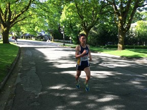 Christian Gravel of Vancouver, who finished fourth overall in Sunday's Oasis Shaughnessy 8K & TNT 5K Poker  Walk, works his way through the scenic residential streets. It took him 25:35 to complete the undulating course — one minute and 17 seconds behind winner Paul Kimugul.