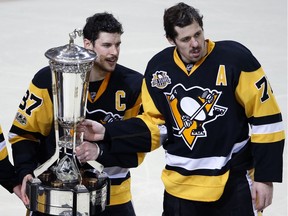 A year after Halifax decided to consider naming a street after Sidney Crosby, the hockey superstar suddenly finds himself embroiled in an ugly political mess that has some residents openly musing about rescinding the offer. Pittsburgh Penguins' Sidney Crosby (87) and Evgeni Malkin (71) pose with the the Prince of Wales Trophy after beating the Ottawa Senators 3-2 in the second overtime period during Game 7 of the Eastern Conference final in the NHL Stanley Cup hockey playoffs in Pittsburgh, Thursday, May 25, 2017.