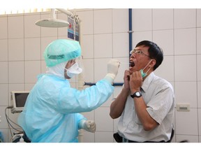 Taiwan's Center for Disease Control takes part in an exercise at Taoyuan airport outside Taipei, simulating the arrival and isolation of a tourist suspected of carrying the deadly Ebola virus.