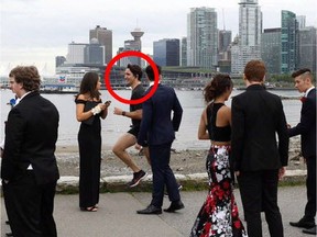 TOFINO, B.C.: AUGUST 5, 2016 – Canada's Prime Minister Justin Trudeau is captured shirtless in a wet suit in the background of a photograph snapped by wedding photographer Marie Recker at an summer 2016 wedding in Tofino, B.C. The photo went viral after Recker shared it on her Facebook page on Aug. 5, 2016. [PNG Merlin Archive]