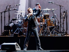 L-R) Bono and Larry Mullen Jr. of rock band U2 perform on stage during their 'The Joshua Tree World Tour' opener at BC Place on May 12, 2017 in Vancouver, Canada.