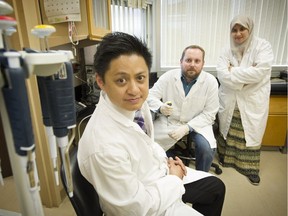 From left, Dr. Paul Yong  and Dr. Mike Anglesio  have discovered cancer-related gene mutations in benign tissue of women with endometriosis, a common inflammatory condition causing pelvic pain and infertility. Grad student Lobna Abdellatif also works in their B.C. Women's Hospital lab.  Their study is published in the New England Journal of Medicine.
