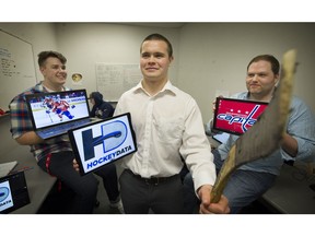 Cole Gawenda of Vancouver, front, the 20-year old co-founder of hockey analytics firm HockeyData Inc. with colleagues Brian Guindon, right, and Jens Persson-Thomas in their downtown office. The NHL's Washington Capitals are presently one of their biggest clients.