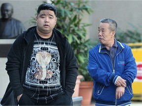 Family members of Peng Sun, including father Cang Sun, right, at B.C. Supreme Court in Vancouver on Feb. 21. Peng Sun's body was found in North Vancouver in September 2015 after his abduction and murder.