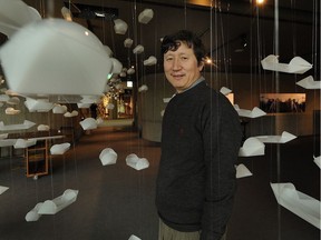 Gu Xiong stands in an installation piece he created in 2010 at the Museum of Anthropology.