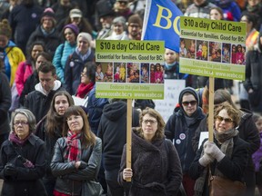 People rally in front of the Vancouver Public Library in Vancouver, B.C., March 4, 2017. Demonstrators took to the streets Saturday, March 4, 2017 in downtown Vancouver to protest the provincial government's handling of poverty and welfare rates. B.C. is the only province in Canada with a poverty reduction plan, even though almost 600,000 British Colubians live in Poverty. Welfare rates have been frozen at $610 per month for the last decade.