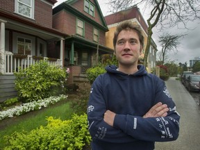 Vancouver, BC: May 05, 2017 -- Louis Lapprend stands on Keefer Street in Vancouver, BC Friday, May 5, 2017. The house behind Lapprend is derelict and is bad disrepair, and he worries it may be affecting his property.
