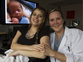 Twenty-six-year-old Brittany Forrest, left, had a heart attack while delivering her baby, Jaxon, pictured behind, two months' premature at St. Paul's Hospital. Forrest is pictured with Dr. Elisabet Joa, a member of the St. Paul's cardiac team that saved her and her baby's life.
