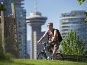 People enjoy the beautiful weather around False Creek in Vancouver on Victoria Day.