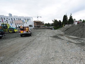 Construction site: Work on the new Emily Carr building, left, and a private project, right. Lots 6 and 7 of the property, foreground, are subject to an untendered sale agreement.