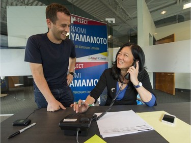 Incumbent North Vancouver-Lonsdale Liberal candidate Naomi Yamamoto shares a laugh with campaign volunteer Max Rubin before polls closed on Tuesday.