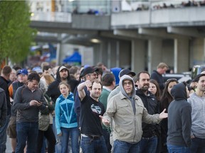 Fans show their displeasure at the long wait to get into B.C. Place Stadium for the U2 concert on Friday.