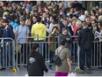 U2 fans line-up for the concert that opens the band's Joshua Tree North American tour at B.C. Place Stadium in Vancouver on Friday.