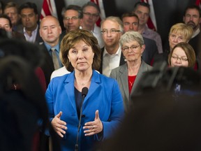 Premier Christy Clark, in front of the B.C. Government caucus, answers questions from the media,  Vancouver, May 16 2017.