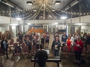 Choir Director Matt Smith conducts an informal rock choir rehearsal at the Wisehall, Vancouver, May 17 2016.