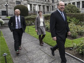 Adam Olsen, winner in Saanich North and the Islands , B.C. Green Party Leader Andrew Weaver and Sonia Furstenau, who won in Cowichan Valley arrive for a press conference at the B.C. legislature last week.