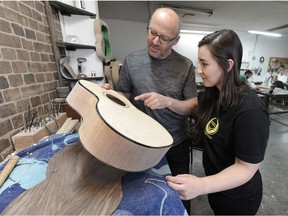 Amateur guitar maker Shaw Saltzberg, left, and Vancouver luthier Meredith Coloma are producing the first Vancouver International Guitar Festival in June.