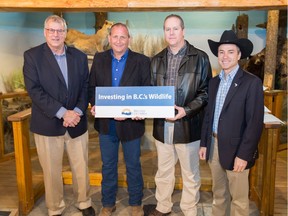 Jim Glaicar (centre left) with then-Forests Minister Steve Thomson (left), Guide Outfitters Association of B.C. director Scott Ellis, and Agriculture Minister Norm Letnick in March.