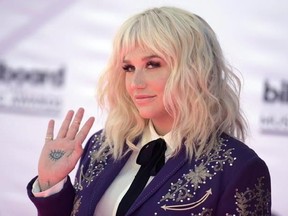 FILE - In this May 22, 2016, file photo, Kesha arrives at the Billboard Music Awards at the T-Mobile Arena in Las Vegas. Video shows Kesha interrupting an interview Jerry Seinfeld was doing an interview with a local news reporter ahead of the ‚ÄúNight of Laughter & Song‚Äù event at the Kennedy Center Monday, June 5, 2017. The singer wanted a hug from the comedian, but Seinfeld repeatedly declined, backing off and telling her, ‚Äúno thanks.‚Äù (Photo by Richard Shotwell/Invision/AP, File)