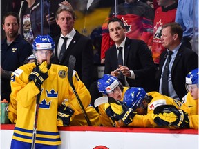 Elias Pettersson #14 and head coach Tomas Monten of Team Sweden look on after losing to Team Canada during the 2017 IIHF World Junior Championship semifinal game at the Bell Centre on January 4, 2017 in Montreal, Quebec, Canada.
