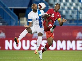 Canada&#039;s Patrice Bernier and Curacao&#039;s Germaine Agustien leap for the ball during second half of a friendly match, in Montreal on Tuesday, June 13, 2017. THE CANADIAN PRESS/Paul Chiasson