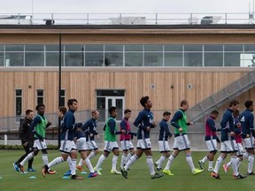 Vancouver Whitecaps players run through drills during practice outside the MLS soccer team&#039;s new National Soccer Development Centre training facility at the University of British Columbia in Vancouver on June 14, 2017. A two-week break between games was supposed to help the Vancouver Whitecaps rest and recuperate following a busy start to the season.They instead lost two more key pieces to injury. THE CANADIAN PRESS/Darryl Dyck