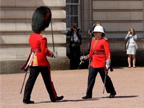 Canadian Captain Megan Couto, right, makes history by becoming the first female Captain of the Queen&#039;s Guard as she takes part in the Changing the Guard ceremony at Buckingham Palace in London, Monday, June 26, 2017. Couto and her unit, The Second Battalion, Princess Patricia&#039;s Canadian Light Infantry (2PPCLI), known as &ampquot;The Patricia&#039;s&ampquot;, took part in the ceremony Monday to coincide with the 150th anniversary of Canada and the sesquicentennial anniversary of Canadian Confederation. (AP Photo/Matt