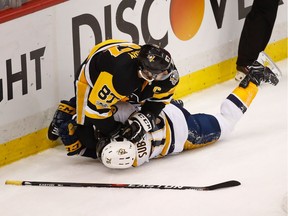 Pittsburgh Penguins captain Sidney Crosby pushes Nashville Predators defenceman P.K. Subban’s head into the ice during one of their frequent physical exchanges in Game 5 of the Stanley Cup final on Thursday in Pittsburgh.
