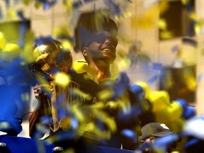 Stephen Curry and his Golden State Warriors, seen celebrating with the Larry O'Brien NBA championship trophy during the team’s victory parade in Oakland on Thursday, are already installed as heavy favourites to take next year’s title — which in that event would be the Warriors’ third championship in four seasons.
