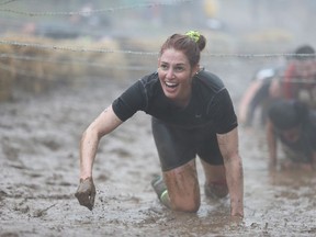 A participant in the Spartan Race is seen in this undated handout image. Obstacle course races are long and gruelling, often leaving people caked in mud, drenched and weary - and thousands are registering to take part.