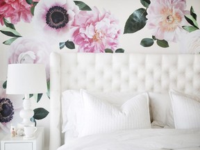 A wall is decorated with floral decals from the brand Urbanwalls.